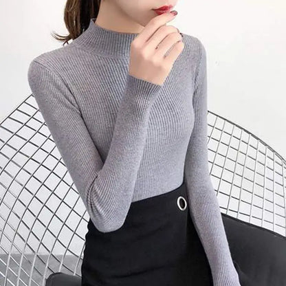 Fitted knit sweater with stand-up collar – simple, cozy, and perfect for stylish looks on cool days.