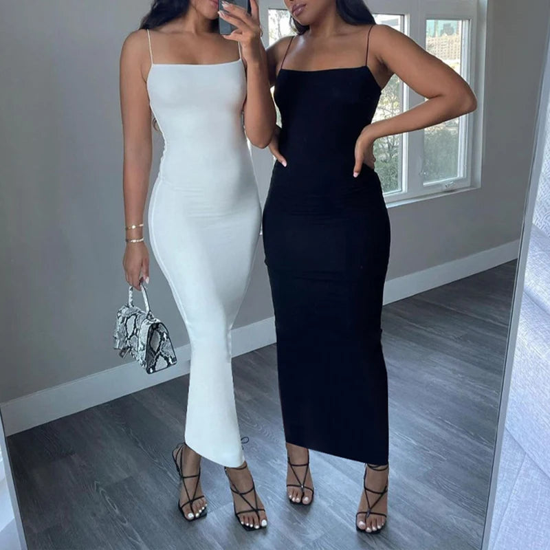 Black bodycon dress with spaghetti straps and back cutout – sleeveless, figure-hugging, and ideal for club or streetwear.