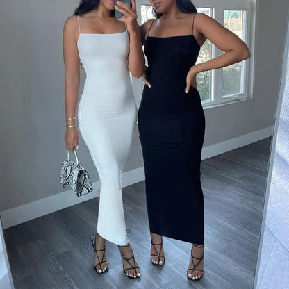 Black bodycon dress with spaghetti straps and back cutout – sleeveless, figure-hugging, and ideal for club or streetwear.