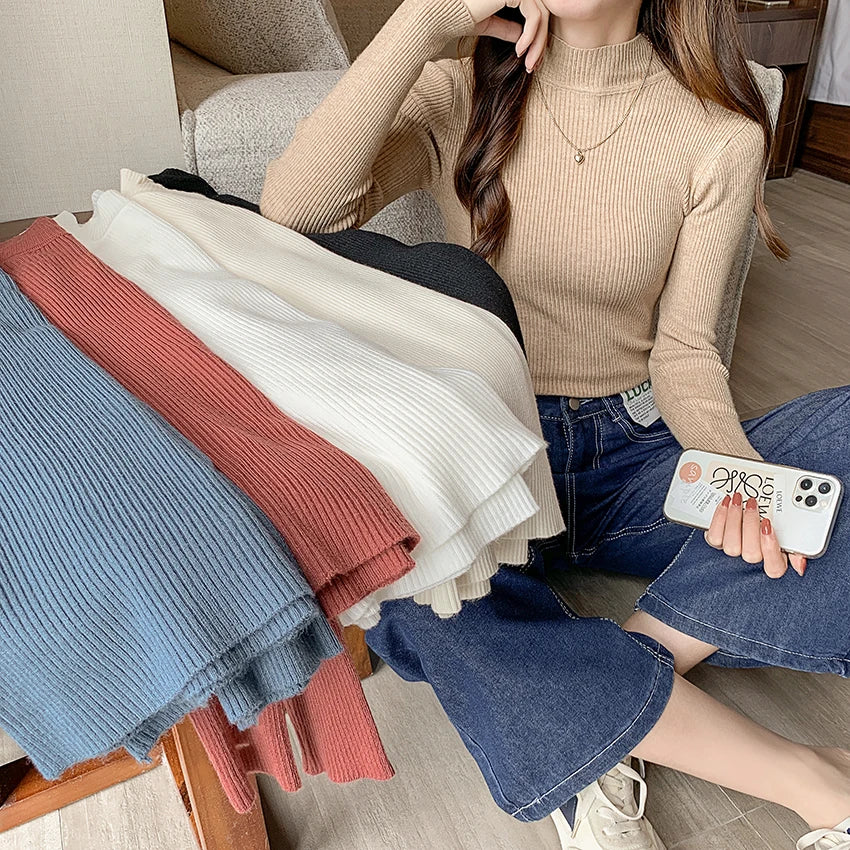 Fitted knit sweater with stand-up collar – simple, cozy, and perfect for stylish looks on cool days.