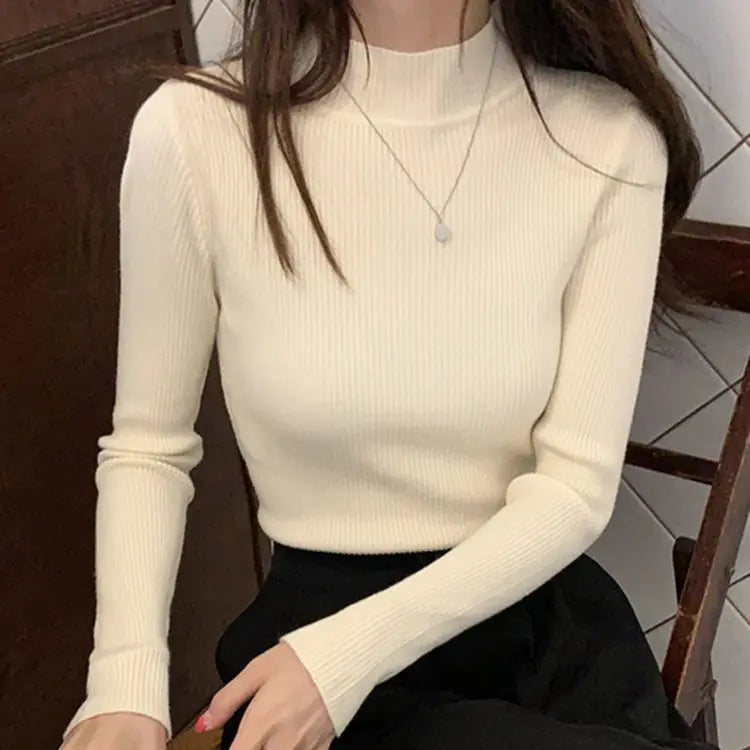 Fitted knit sweater with stand-up collar – simple, cozy, and perfect for stylish looks on cool days.