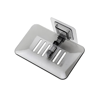 Transparente Seifenablage zur Wandmontage ohne Bohren – selbstklebend, mit Abflussdesign und ideal für Dusche oder Waschbecken.