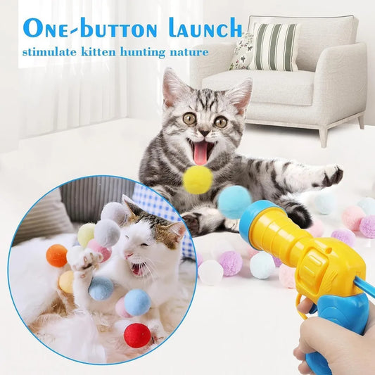 Katzenspielzeug mit Plüschball-Shooter – schießt Mini-Pompoms für interaktiven Spielspaß, ideal zur Beschäftigung von Wohnungskatzen.