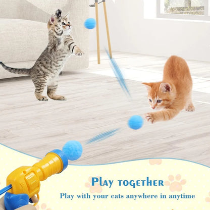 Katzenspielzeug mit Plüschball-Shooter – schießt Mini-Pompoms für interaktiven Spielspaß, ideal zur Beschäftigung von Wohnungskatzen.