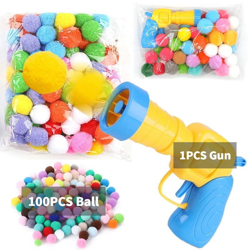 Katzenspielzeug mit Plüschball-Shooter – schießt Mini-Pompoms für interaktiven Spielspaß, ideal zur Beschäftigung von Wohnungskatzen.
